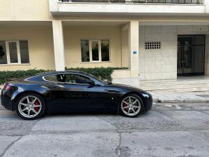 a black car parked in front of a building at Palace Apartment in Athens
