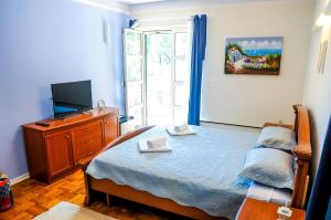 Postel nebo postele na pokoji v ubytování Room and Apartment Perlica