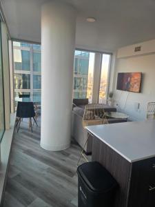a living room with a couch and a table at 2 Bedroom with City Views in Los Angeles