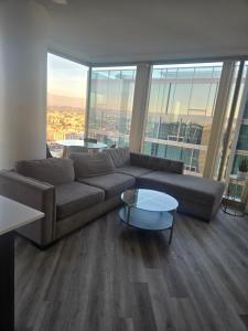 a living room with a couch and a table at 2 Bedroom with City Views in Los Angeles