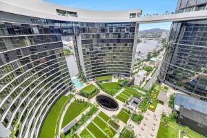 an aerial view of a tall building in a city at Gorgeous 3BR Apartment with Study overlooking BNE River in Brisbane