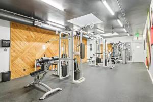 a fitness room with a gym with tread machines at Beachfront Resort-sunset views deck & luxe king in Oceanside