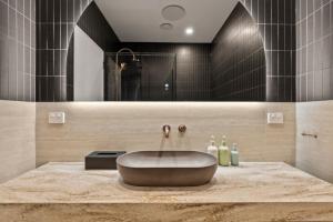 a bathroom with a large sink on a marble counter at Mantons Creek Estate in Shoreham +18 photos