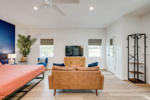 a bedroom with a bed and a couch and a tv at Ranchette Apartment- beach access small lake view in Buchanan Dam