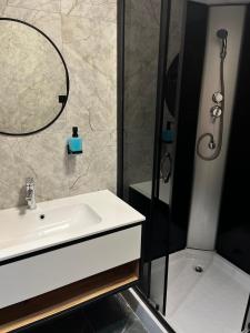 a bathroom with a sink and a shower at Gora vitriv in Slavske +26 photos