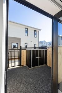 a view from a garage door of a house at Private ensuite room on the beach in Christchurch