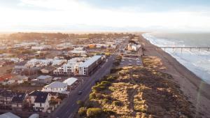 an aerial view of a beach with houses and the ocean at Private ensuite room on the beach in Christchurch