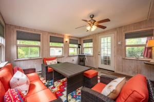a living room with a couch and a table at On Deep Creek Time by Railey Vacations in Friendsville