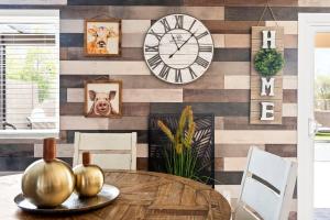 a dining room with a table and a clock on a wall at Superstition Sunrise in Gold Canyon +21 photos