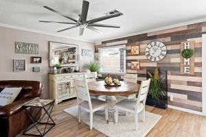 a dining room with a table and a ceiling fan at Superstition Sunrise in Gold Canyon