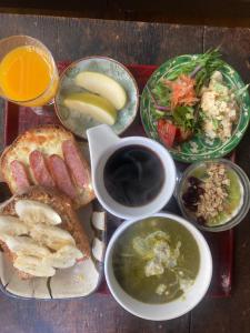 a tray of food with different types of food at YAMABE BOSSA inn in Matsumoto
