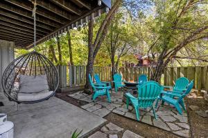 a group of chairs and a swing on a patio at High Pines Abode in Flagstaff
