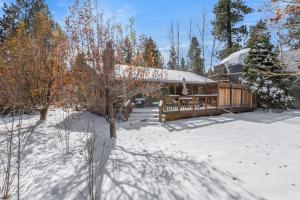 a house in the snow with a snow covered yard at Piece of Paradise in Big Bear Lake