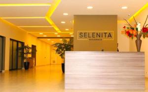 a lobby with a reception counter in a building at Flat Novo1 - Café, Cama Queen, Ar, Estac e Internet in Barueri +23 photos
