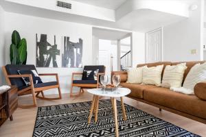 a living room with a couch and a table at The Seaside Bohemian in Chandler