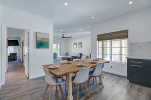 a kitchen and dining room with a wooden table and chairs at DL882 - Desert Falls Poolside Escape - Alice Lodging in Palm Desert