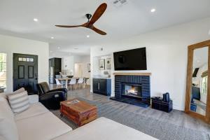 a living room with a couch and a fireplace at DL882 - Desert Falls Poolside Escape - Alice Lodging in Palm Desert +22 photos