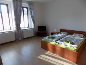 Postel nebo postele na pokoji v ubytování Agropenzion U Bartousku
