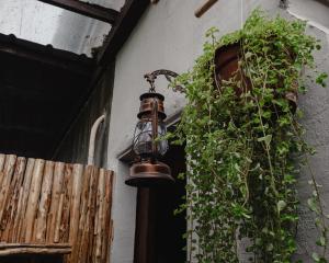 an old bell hanging on the side of a building at Hayag in General Luna