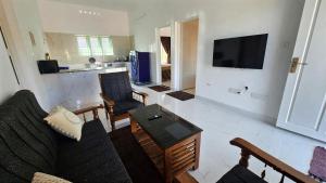 a living room with a couch and a table at Beverly Hills Vagamon in Vagamon