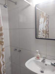 a white bathroom with a sink and a shower at Las Tres Reinas A in Colorado River