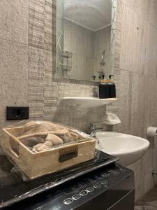 a bathroom with a sink and a toilet and a mirror at Tara Home 44 in Sheikh Zayed