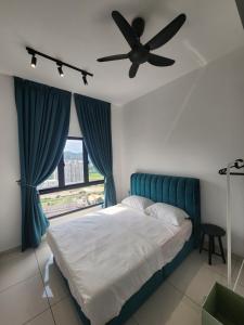 a bedroom with a bed with a ceiling fan at Horizon Rooftop Skypool Condotel - Ipoh in Ipoh +74 photos