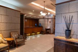 a lobby with chairs and a waiting room at Mori-no-Hotel Sendai in Sendai