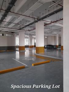 a parking lot with a car parked in it at Carol sweet room in Cebu City
