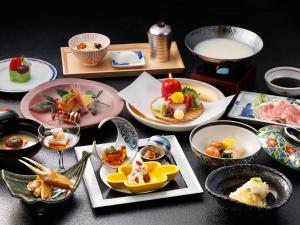 a table with many plates of food on it at Hamanoyu in Suwa +69 photos