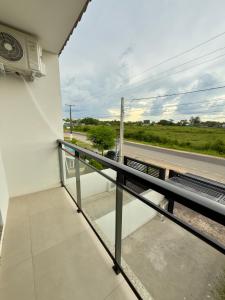 a balcony with a view of a train track at Sobrado NOVO próximo BR 290 in São Gabriel