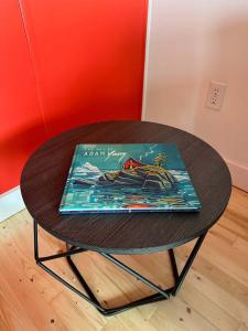 a table with a book sitting on top of it at Iceberg Lookout in Twillingate