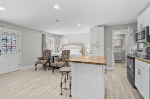 a kitchen and a bedroom with a bed and a table at The Reserve Retreat in Sarasota +30 photos