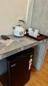 a appliance sitting on top of a kitchen counter at Pakmeng Beach Resort in Pak Meng