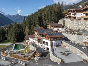 an aerial view of a building with a tennis court at Luxury alpine chalet in Neukirchen in Neukirchen am Großvenediger