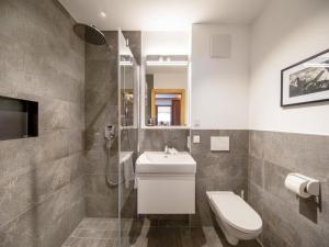 a bathroom with a toilet and a sink at Chalet with sauna, Neukirchen in Neukirchen am Großvenediger +48 photos