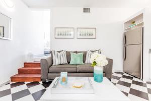 a living room with a couch and a table at Mint Suite - 1 BR in Old San Juan in San Juan