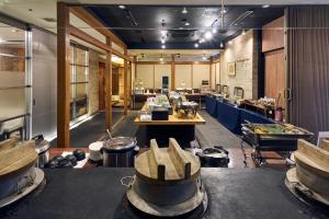 a large room with tables and equipment in a building at Hotel Lexton Kagoshima in Kagoshima