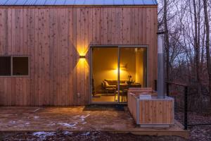 a house with a sliding glass door with a patio at The Klover in Logan