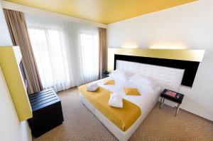Postel nebo postele na pokoji v ubytování Grandior Hotel Prague