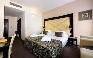 Postel nebo postele na pokoji v ubytování Grandior Hotel Prague