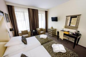Postel nebo postele na pokoji v ubytování Grandior Hotel Prague