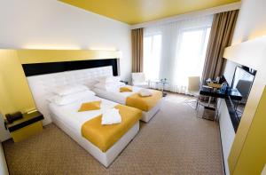Postel nebo postele na pokoji v ubytování Grandior Hotel Prague