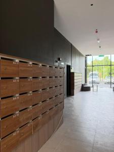 a hallway with wooden lockers in a building at Roxy Hotel & Apartment Lawas in Lawas