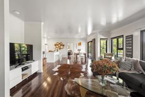 a living room with a couch and a table at Hartzell One Seven - Private - Family Friendly in Wilyabrup