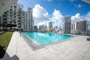 a large swimming pool on the roof of a building at Downtown Skyline Heights with Stunning Ocean View in Miami