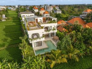 an aerial view of a house with a swimming pool at Sapta Cemagi - Villa Deluna in Cemagi
