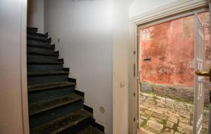 a staircase leading up to a door with a window at Casa Herea in Ragusa
