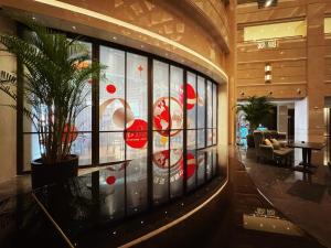 a lobby with a large window in a building at Oriental Riverside Bund View Hotel (Shanghai International Convention Center) in Shanghai +48 photos