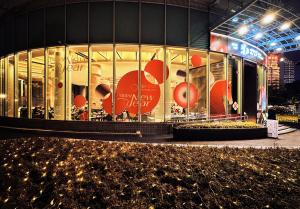 a store front with a display window at night at Oriental Riverside Bund View Hotel (Shanghai International Convention Center) in Shanghai